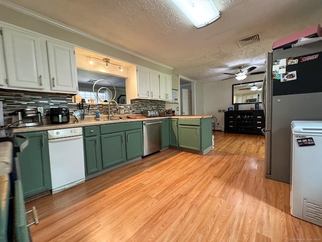 860 Suffield St, Suffield, CT 06078 - kitchen featuring green cabinets, stainless steel appliances, ceiling fan, decorative backsplash, and a textured ceiling