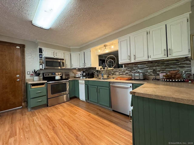 860 Suffield St, Suffield, CT 06078 - kitchen featuring appliances with stainless steel finishes, green cabinetry, light wood-type flooring, tasteful backsplash, and a textured ceiling