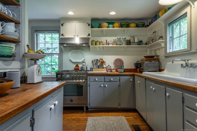 32 Cherniske Rd, New Milford, CT 06776 - kitchen with high end stainless steel range oven, wall chimney range hood, open shelves, gray cabinets, and dark wood-style flooring