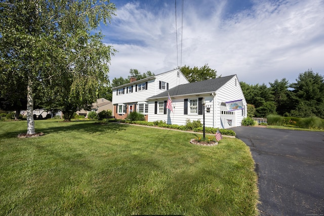 622 Wiese Rd, Cheshire, CT 06410 - colonial inspired home with driveway, a front yard, a chimney, and an attached garage
