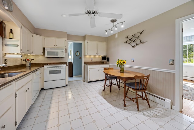 622 Wiese Rd, Cheshire, CT 06410 - kitchen with white appliances, a wainscoted wall, light flooring, ceiling fan, and white cabinets