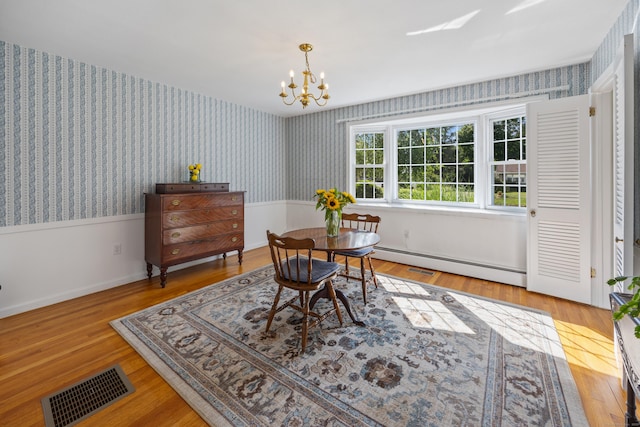 622 Wiese Rd, Cheshire, CT 06410 - dining area with a chandelier, wallpapered walls, a baseboard radiator, and wood finished floors