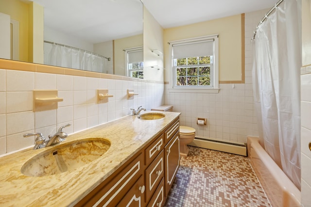 622 Wiese Rd, Cheshire, CT 06410 - bathroom with a baseboard radiator, tile walls, double vanity, shower / bath combination with curtain, and wainscoting
