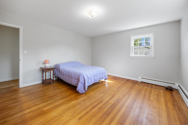 622 Wiese Rd, Cheshire, CT 06410 - bedroom with light wood-style flooring and a baseboard radiator