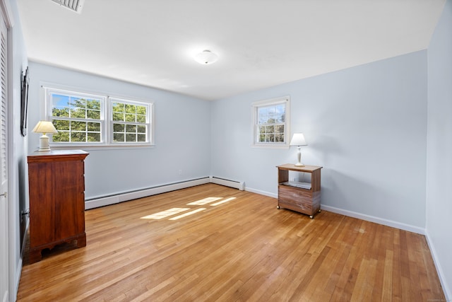622 Wiese Rd, Cheshire, CT 06410 - unfurnished room with a baseboard heating unit and light wood-type flooring