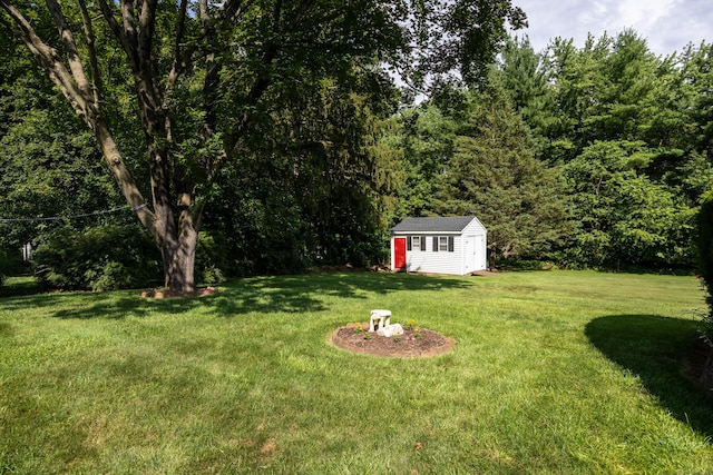622 Wiese Rd, Cheshire, CT 06410 - view of grassy yard with an outbuilding and a view of trees