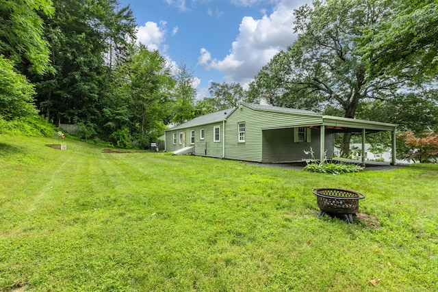 140 Ridgewood Rd, East Hartford, CT 06118 - view of grassy yard with a carport