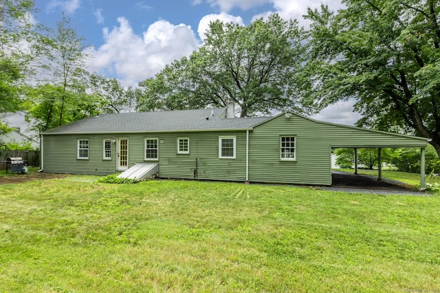 140 Ridgewood Rd, East Hartford, CT 06118 - rear view of house featuring a carport and a lawn