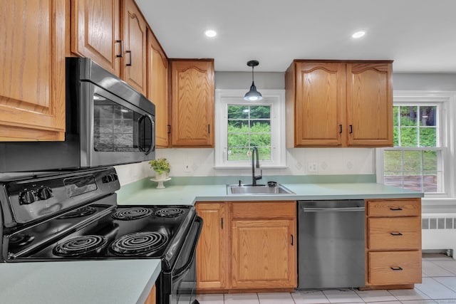 140 Ridgewood Rd, East Hartford, CT 06118 - kitchen with appliances with stainless steel finishes, radiator, healthy amount of natural light, backsplash, and recessed lighting