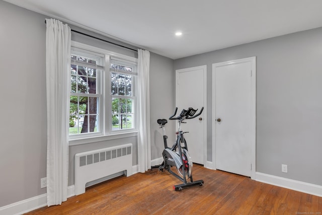 140 Ridgewood Rd, East Hartford, CT 06118 - exercise area featuring radiator, wood finished floors, and recessed lighting