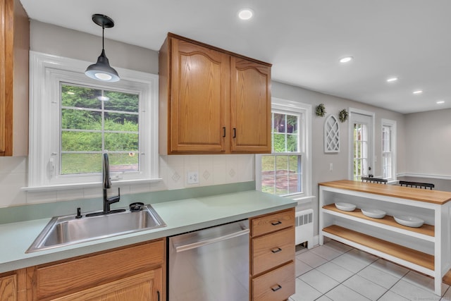 140 Ridgewood Rd, East Hartford, CT 06118 - kitchen with stainless steel dishwasher, light countertops, hanging light fixtures, light tile patterned floors, and recessed lighting