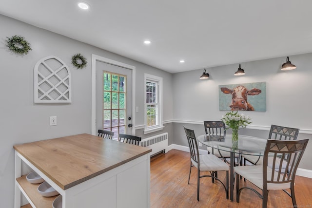 140 Ridgewood Rd, East Hartford, CT 06118 - dining space featuring radiator heating unit, wood finished floors, and recessed lighting