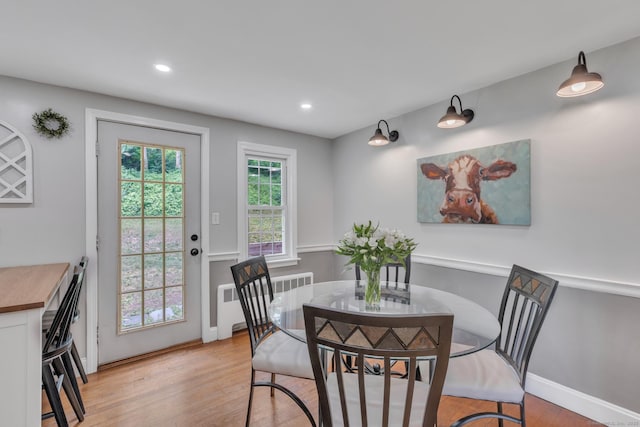 140 Ridgewood Rd, East Hartford, CT 06118 - dining area with radiator heating unit, light wood-type flooring, and recessed lighting