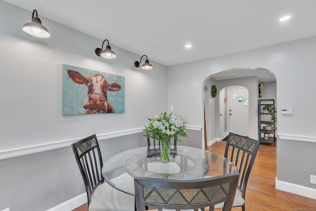 140 Ridgewood Rd, East Hartford, CT 06118 - dining space with arched walkways, wood finished floors, and recessed lighting