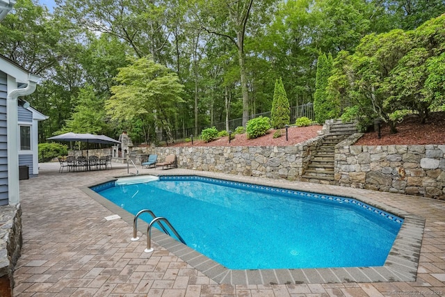 45 Hunting Ridge Rd, Easton, CT 06612 - view of swimming pool with stairway, a patio, a fenced backyard, and outdoor dining area
