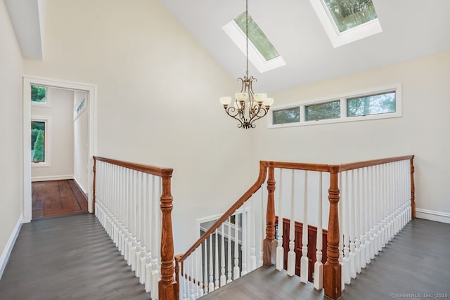 45 Hunting Ridge Rd, Easton, CT 06612 - stairs with a chandelier, high vaulted ceiling, wood finished floors, and a skylight