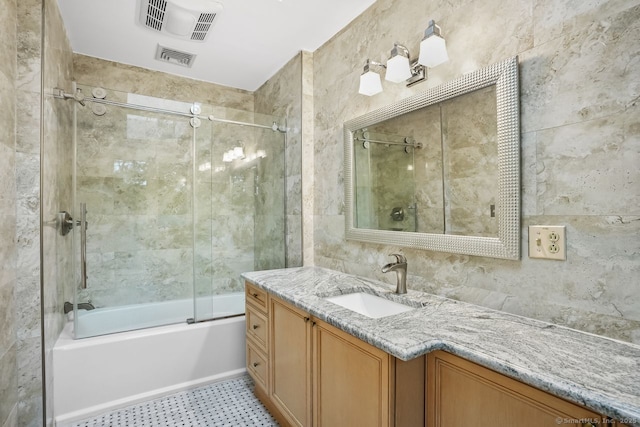 45 Hunting Ridge Rd, Easton, CT 06612 - full bath featuring vanity, combined bath / shower with glass door, tile patterned floors, and tile walls