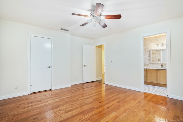 45 Hunting Ridge Rd, Easton, CT 06612 - unfurnished bedroom featuring light wood-style flooring, connected bathroom, and ceiling fan
