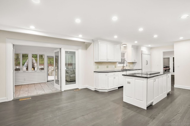 45 Hunting Ridge Rd, Easton, CT 06612 - kitchen featuring dark countertops, dark wood-type flooring, white cabinets, recessed lighting, and a center island
