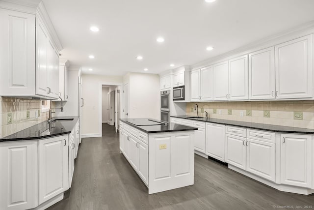 45 Hunting Ridge Rd, Easton, CT 06612 - kitchen with stainless steel appliances, a kitchen island, white cabinetry, dark wood-style flooring, and recessed lighting