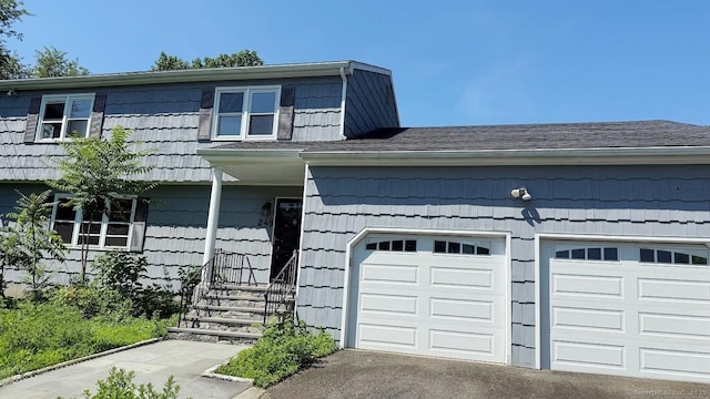 view of front of house with an attached garage and driveway