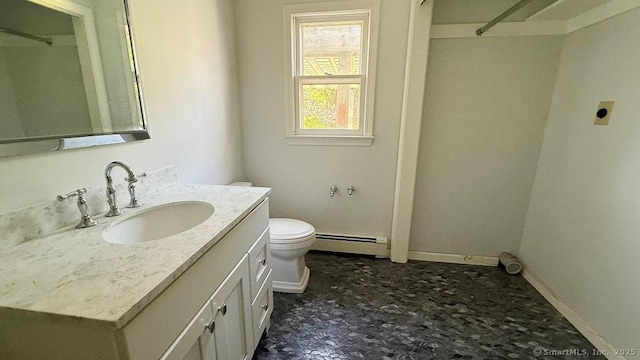 bathroom featuring a baseboard radiator and vanity