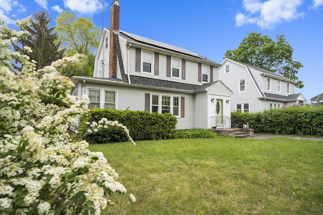 114 Kneeland Rd, New Haven, CT 06512 - rear view of house with a chimney and a lawn
