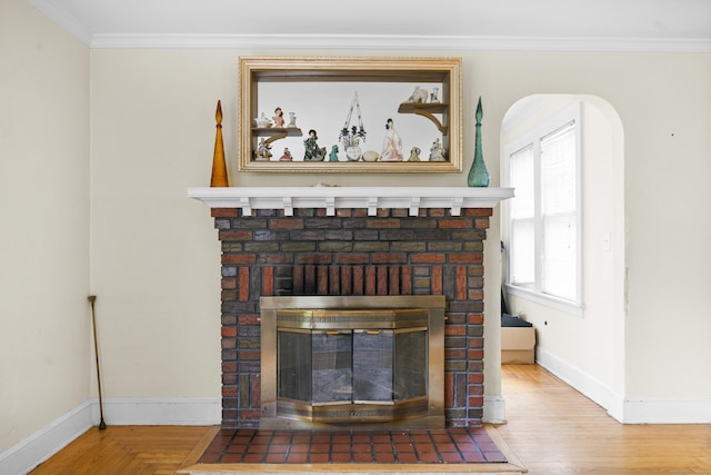 114 Kneeland Rd, New Haven, CT 06512 - detailed view of a brick fireplace, ornamental molding, wood finished floors, and arched walkways