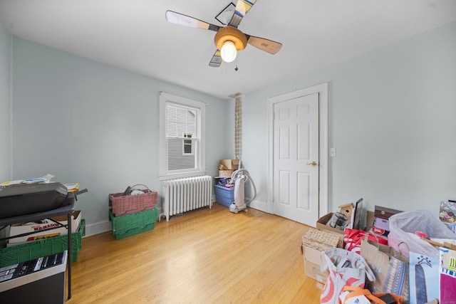 114 Kneeland Rd, New Haven, CT 06512 - rec room with radiator heating unit, wood finished floors, and a ceiling fan