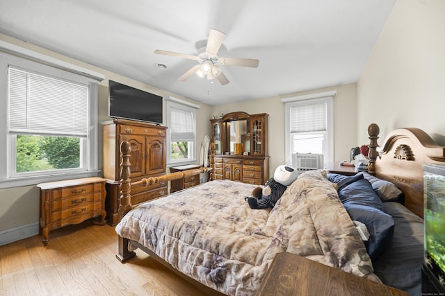 114 Kneeland Rd, New Haven, CT 06512 - bedroom with light wood-type flooring, multiple windows, ceiling fan, and cooling unit