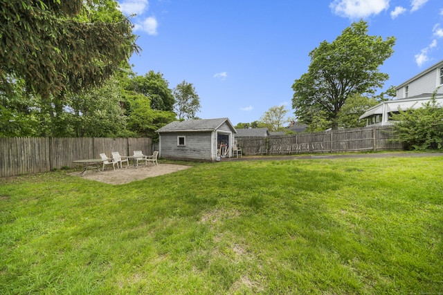 114 Kneeland Rd, New Haven, CT 06512 - fenced backyard with an outbuilding and a patio area