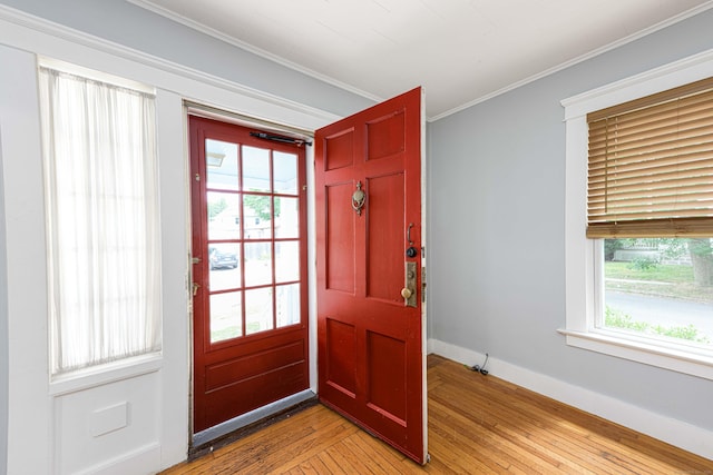 38 Francis Ave, Hamden, CT 06517 - foyer entrance featuring light wood finished floors and crown molding