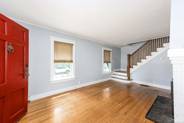 38 Francis Ave, Hamden, CT 06517 - foyer entrance with stairway, hardwood / wood-style floors, and crown molding