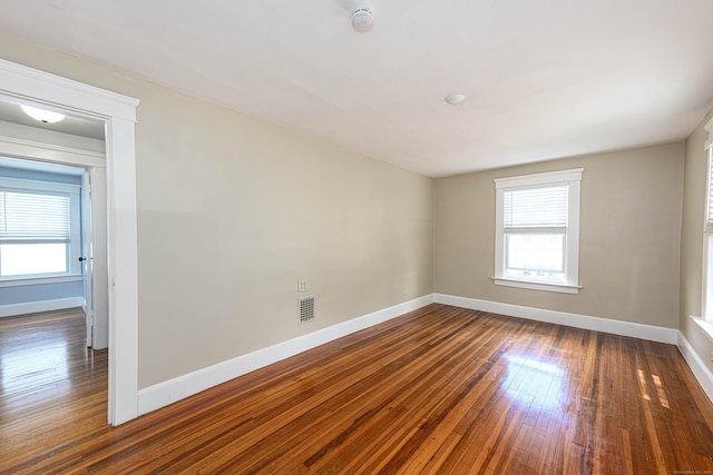 38 Francis Ave, Hamden, CT 06517 - unfurnished room featuring a smoke detector, plenty of natural light, and wood-type flooring