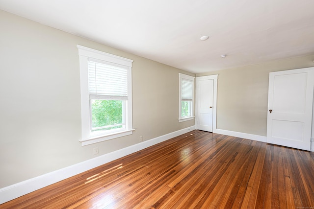 38 Francis Ave, Hamden, CT 06517 - spare room featuring dark wood-type flooring and baseboards