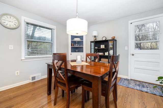 438 Woodland St, Glastonbury, CT 06073 - dining area with light wood finished floors and baseboards