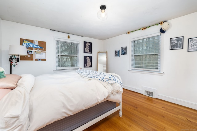 438 Woodland St, Glastonbury, CT 06073 - bedroom with light wood-style flooring and baseboards