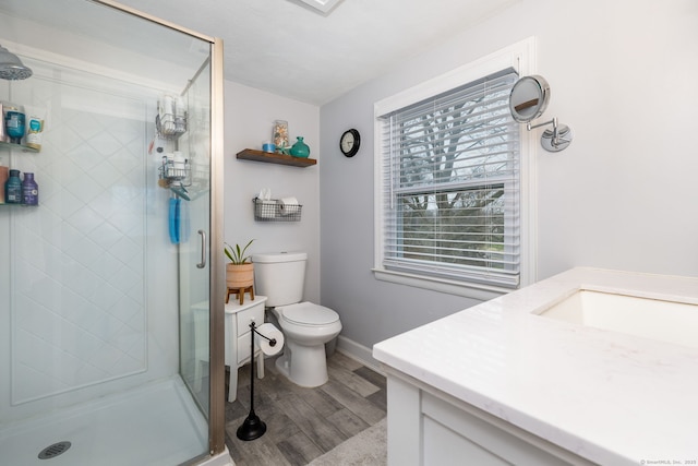 438 Woodland St, Glastonbury, CT 06073 - bathroom featuring vanity, wood finished floors, and a shower stall