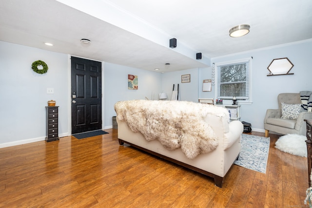 438 Woodland St, Glastonbury, CT 06073 - living area featuring wood finished floors and ornamental molding