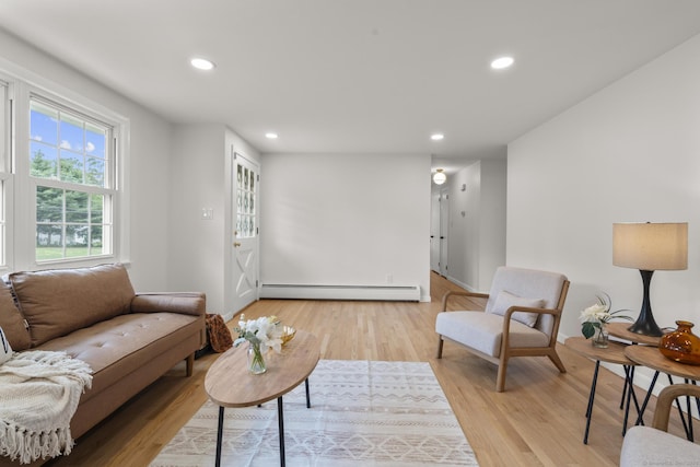 103 Perry Rd, Bristol, CT 06010 - living room featuring baseboard heating, recessed lighting, and light wood-style flooring
