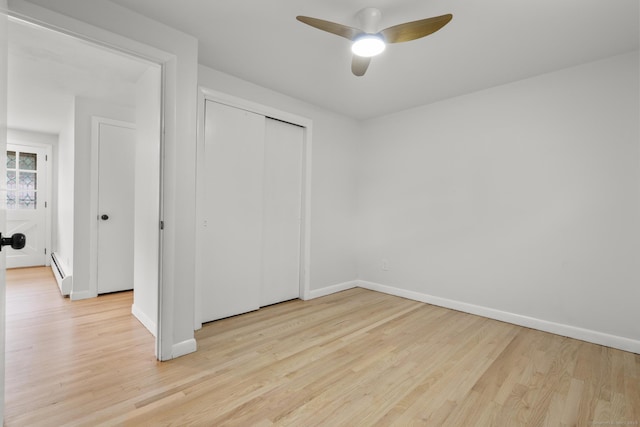 103 Perry Rd, Bristol, CT 06010 - unfurnished bedroom with a baseboard radiator, wood finished floors, a closet, and a ceiling fan