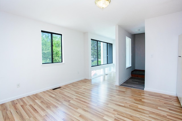 14 Old Mill Ct Unit 14, Simsbury, CT 06070 - empty room featuring plenty of natural light and wood finished floors