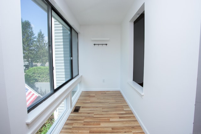 14 Old Mill Ct Unit 14, Simsbury, CT 06070 - corridor featuring light wood-type flooring and baseboards