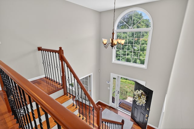 26 Rockwood Dr, Portland, CT 06480 - foyer entrance with a chandelier, wood finished floors, a high ceiling, and stairs