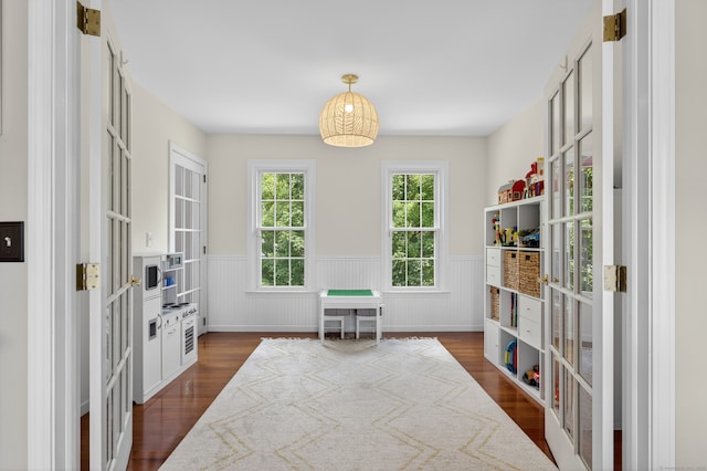 26 Rockwood Dr, Portland, CT 06480 - sitting room featuring a wainscoted wall, dark wood-type flooring, and french doors