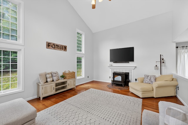 26 Rockwood Dr, Portland, CT 06480 - living room with high vaulted ceiling, a ceiling fan, a wood stove, and wood finished floors