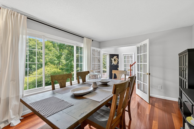 26 Rockwood Dr, Portland, CT 06480 - dining space with french doors and wood finished floors