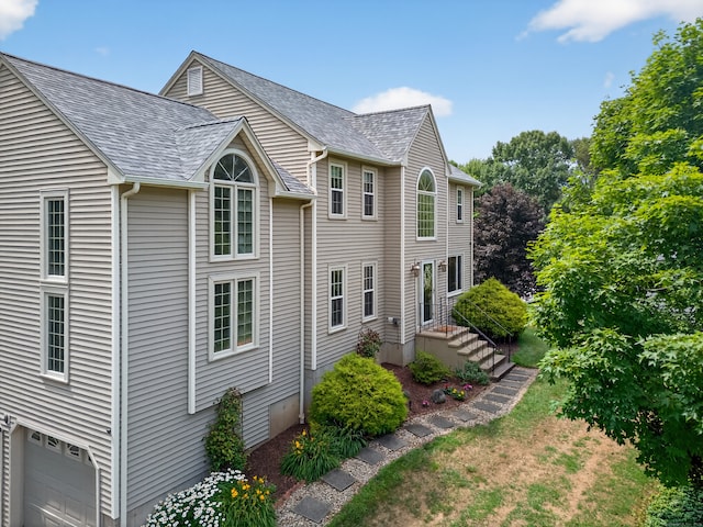 26 Rockwood Dr, Portland, CT 06480 - view of property exterior featuring an attached garage and roof with shingles