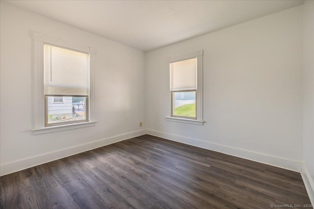118 New Haven Ave, Derby, CT 06418 - empty room with dark wood-style floors and baseboards