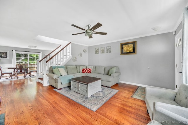 51 Olde Village Cir Unit 51, Wallingford, CT 06492 - living room with stairway, wood finished floors, ceiling fan, and ornamental molding